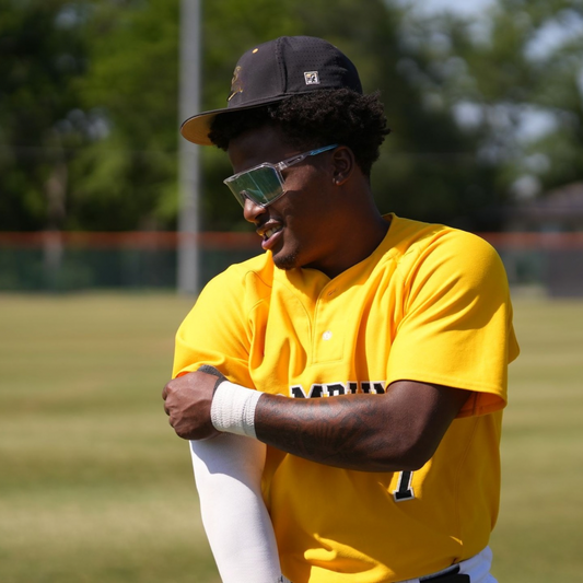 Professional baseball player wearing Locked baseball sport sunglasses while on the baseball field protecting his eyes on a sunny day.