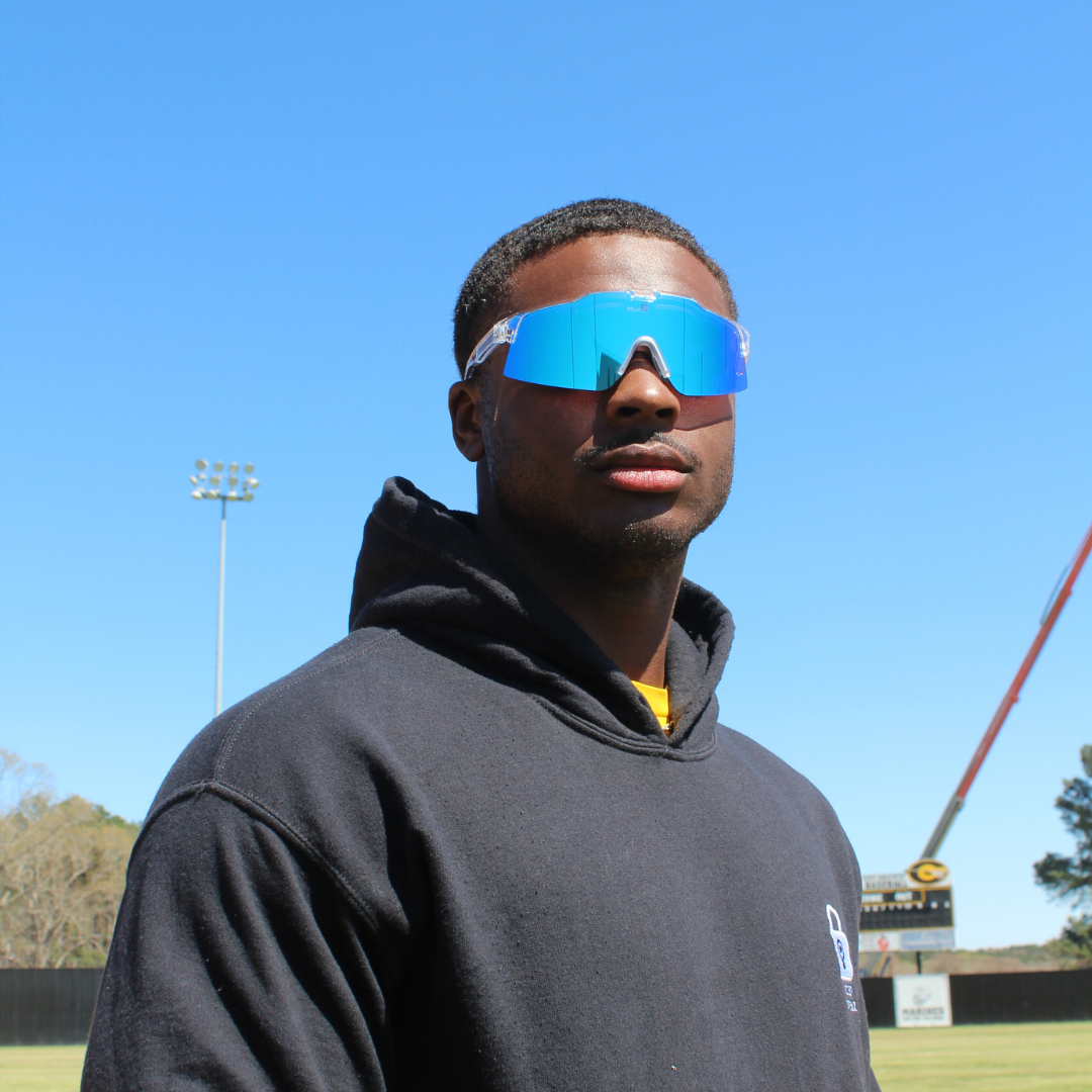 Image of Black Baseball Player wearing the Ace Blue Lens Polarized Baseball Sunglasses on the field.