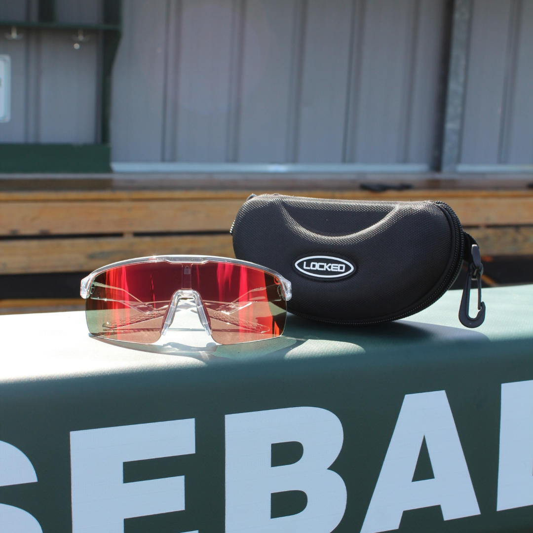 Left side view of Revelation Pro Series sunglasses featuring Oakley-level build, clear frame, and gold reflective lens for elite athletes.