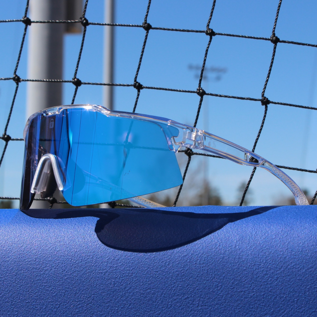 Right angled view of Ace Model Sunglasses showcasing high-quality clear frame and blue reflective lenses, designed for optimal performance in sports.