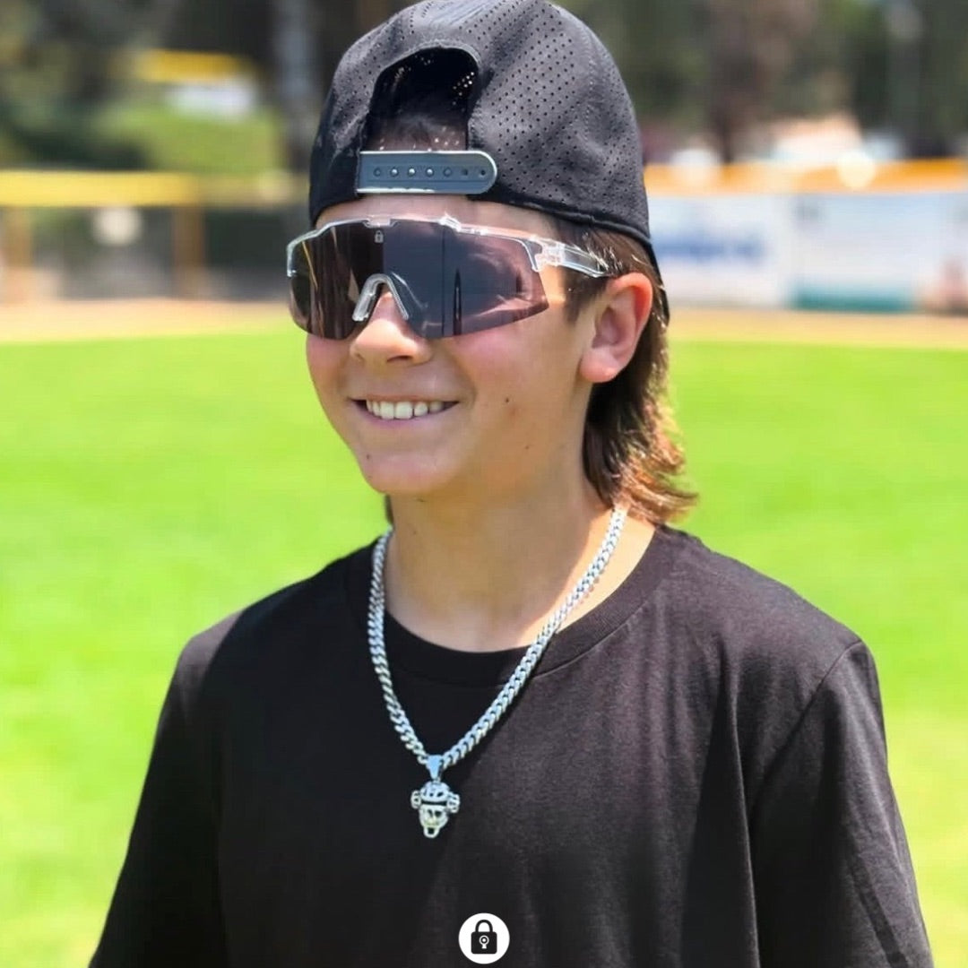Elite baseball player wearing Locked Eyewear sport sunglasses tracking a fly ball in the outfield.