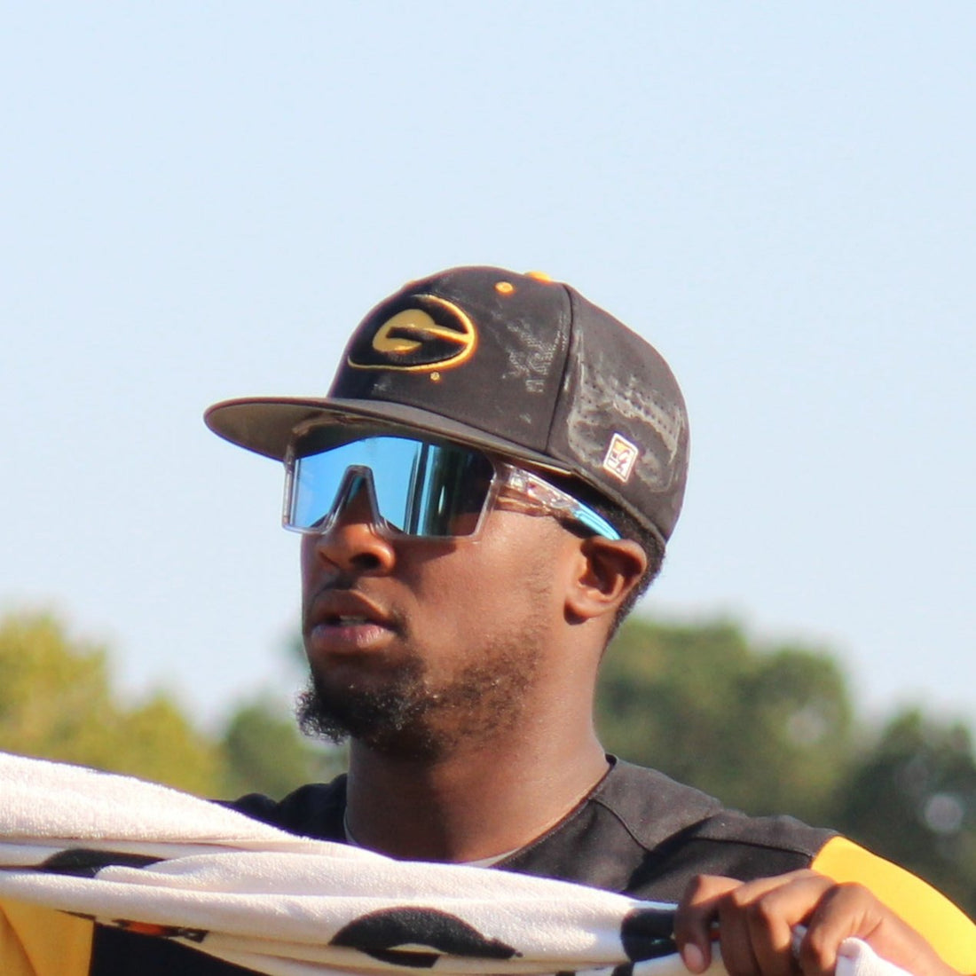 Professional baseball player wearing polarized SlickSlider baseball sunglasses from Locked Eyewear.