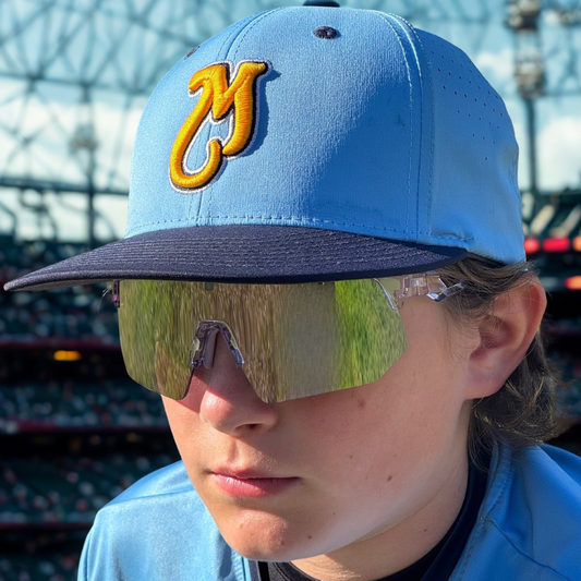 Player from the Georgia Bulldogs wearing Locked Eyewear baseball sunglasses while tracking a fly ball under bright sunlight — representing elite vision, focus, and performance.