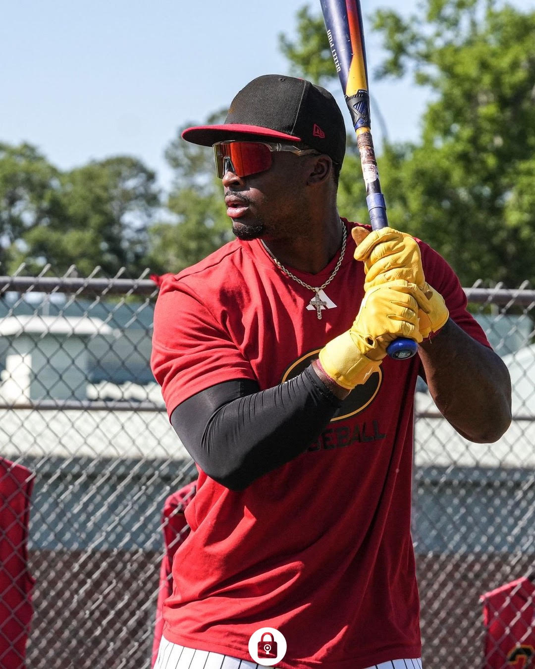 Image of Black Baseball player wearing Locked Performance Baseball Sunglasses while getting ready for the baseball game ahead.