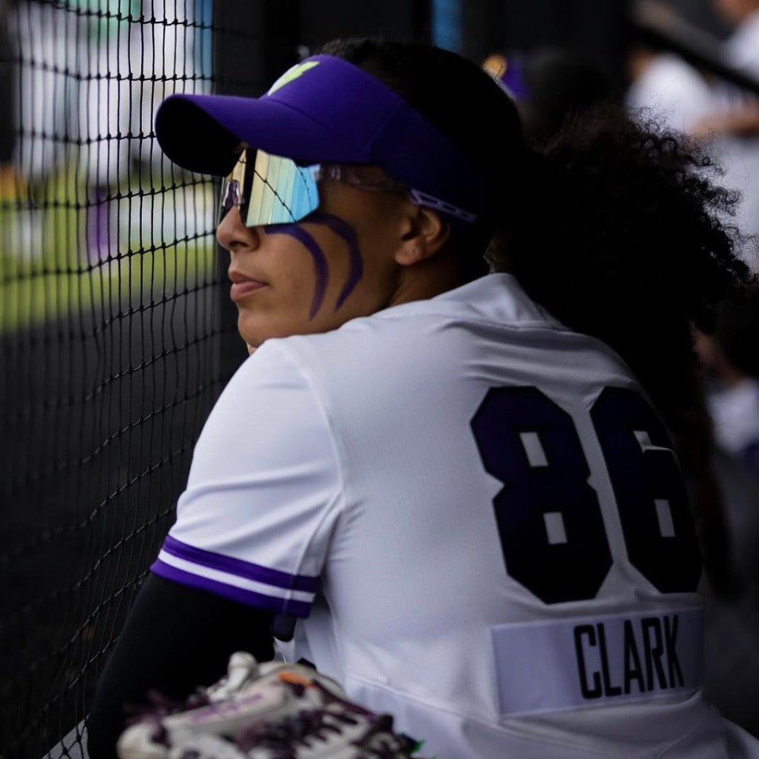Professional softball player focused before the next play wearing the PA10 baseball sunglasses from Locked Eyewear.