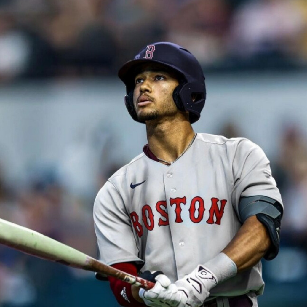 Image of Braden Montgomery in a Boston Red Sox uniform stepping up to the plate to get ready to hit. Montgomery is holding a bat and wearing Locked Eyewear Sport sunglasses.