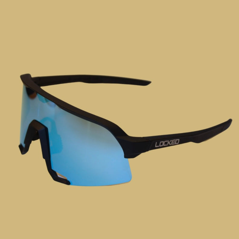 The Royal: The Royal baseball sunglasses at an angled left view, featuring blue polarized lenses and a stylish sturdy design ideal for baseball players seeking eye protection.