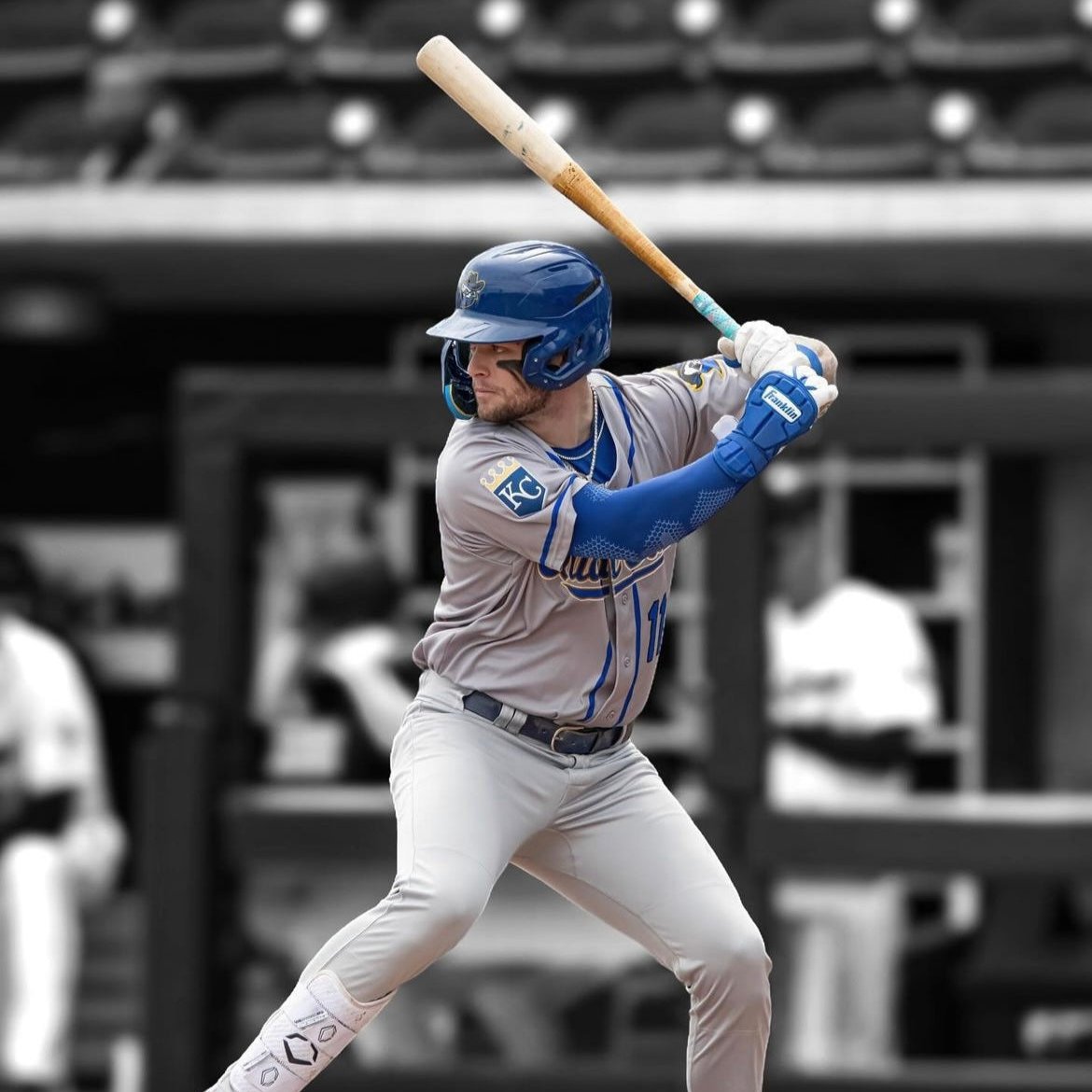 Image of Carter Jensen Professional Baseball player for the Kansas city royals. Jensen is hitting during a baseball game and is wearing Locked eyewear sport sunglasses.