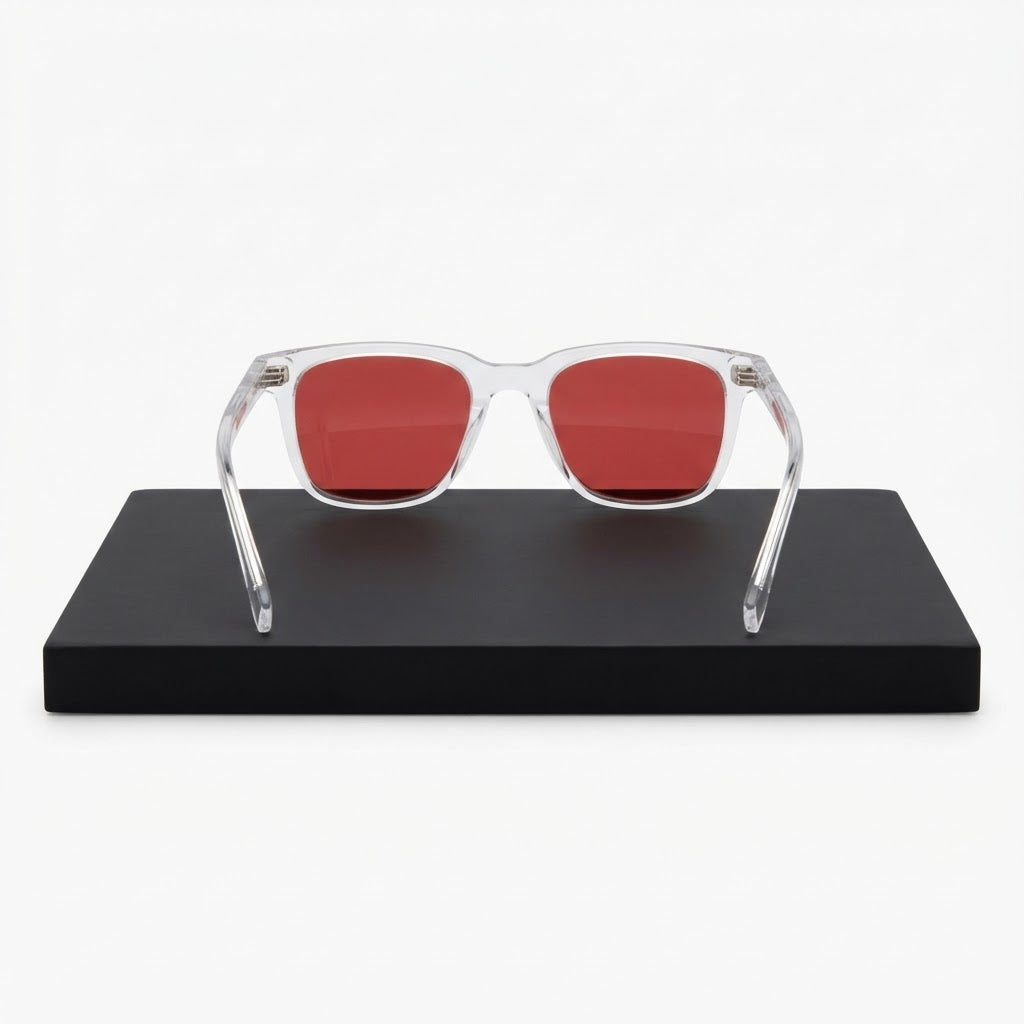 Rear view of Locked Eyewear Deload blue light glasses on a black stand, red lens seen from behind, built for the nighttime wind-down