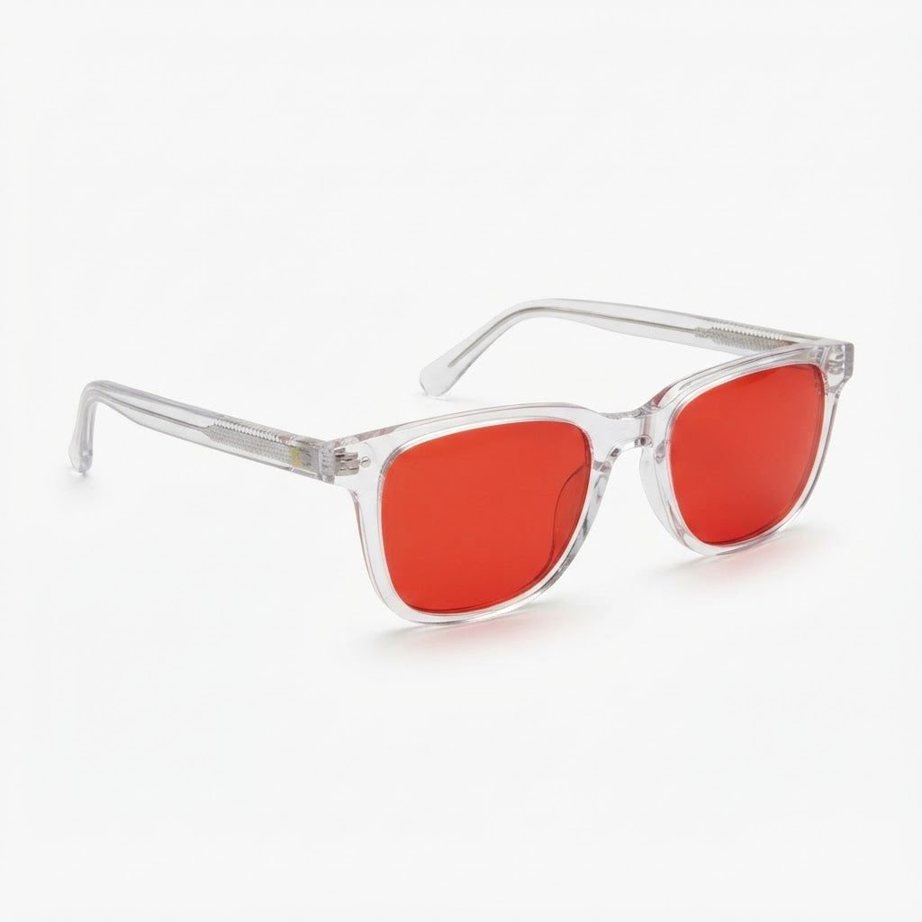 Locked Eyewear Deload red-lens blue light glasses at a three-quarter angle, clear frame and deep red tint built for evening screens and late film study