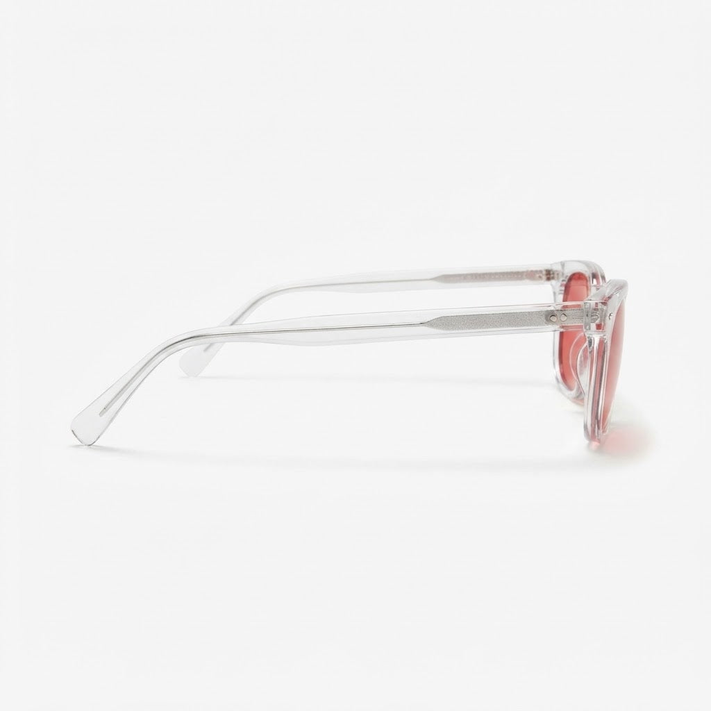 Side profile of Locked Eyewear Deload blue light glasses, clear translucent temple and red lens made for maximum blue light blocking after dark