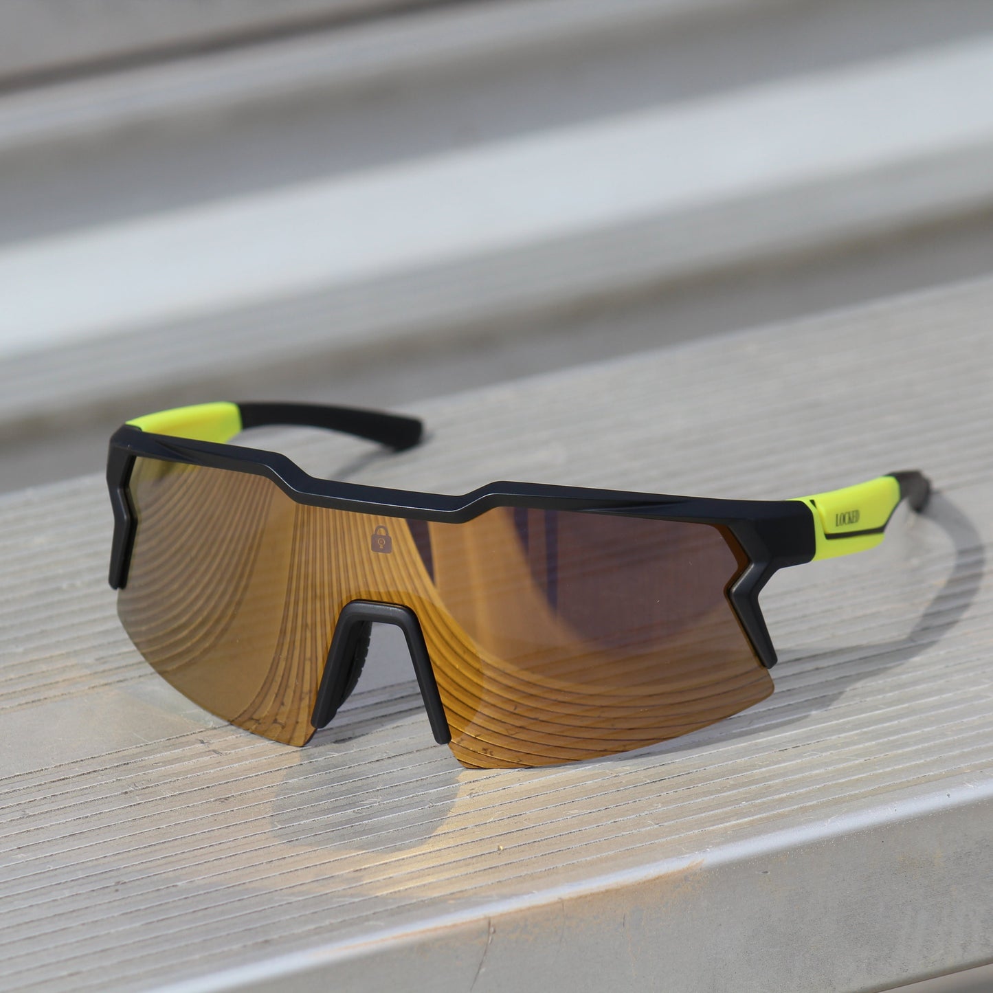 Locked Eyewear Firefly sunglasses with mirror-coated lenses and anti-reflective technology for enhanced visibility during athletic performance