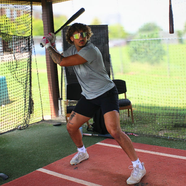 Baseball player in batting catch elevating his vision with Locked PA10 sport sunglasses
