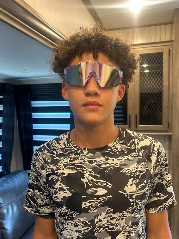 Young baseball player wearing Locked Eyewear sunglasses designed for competitive play