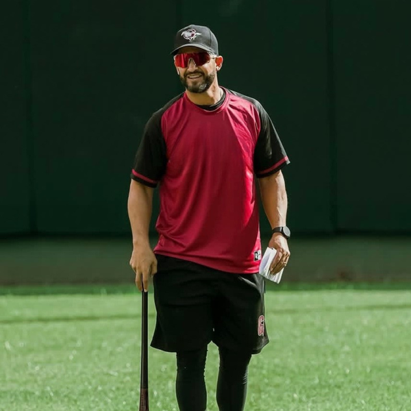 Professional baseball coach wearing polarized baseball sunglasses for sun protection and performance