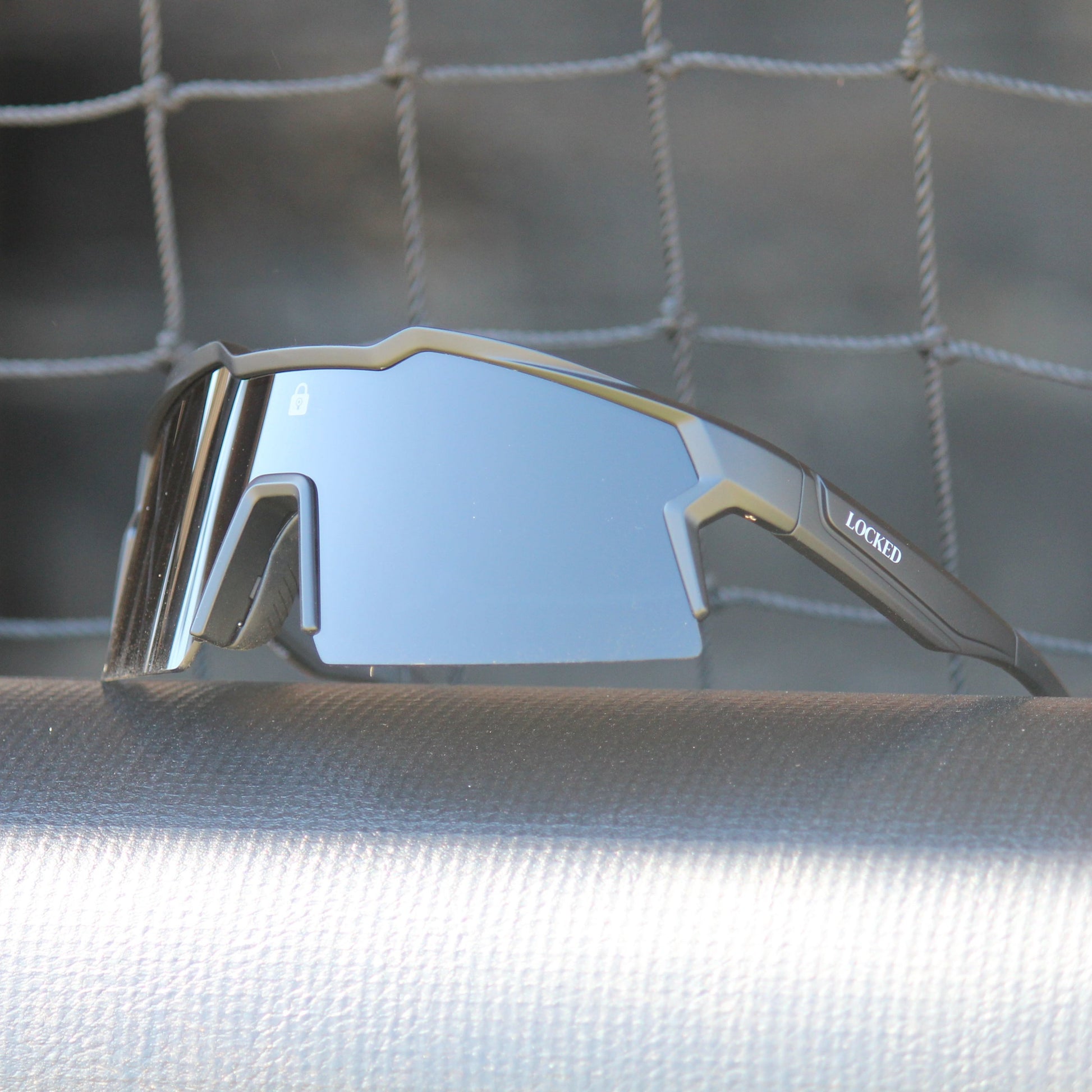 Left-angled view of Locked Eyewear Tiger sunglasses, showcasing lightweight frames and mirror-coated lenses.